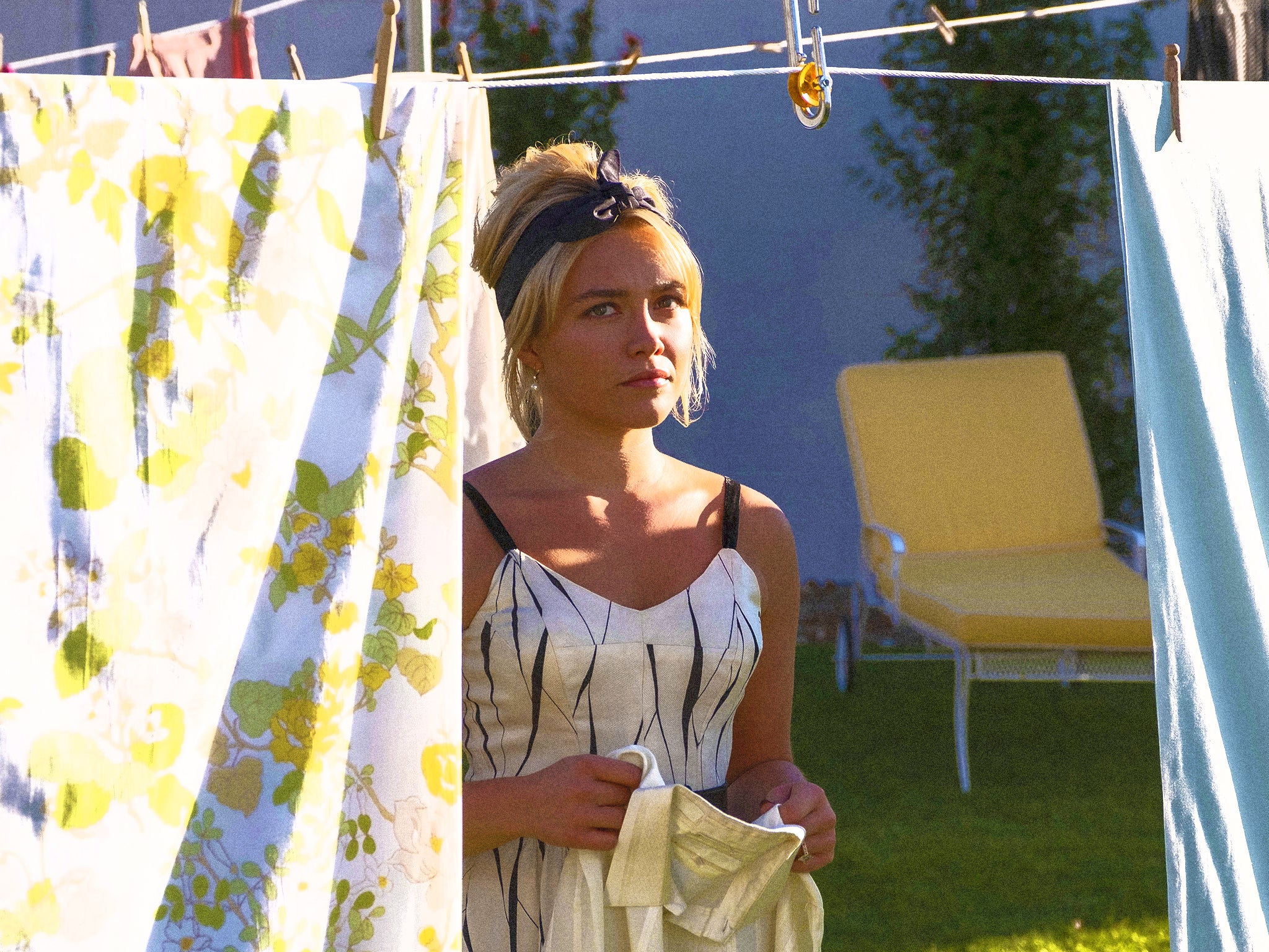 Florence Pugh hangs out the washing in ‘Don’t Worry Darling’
