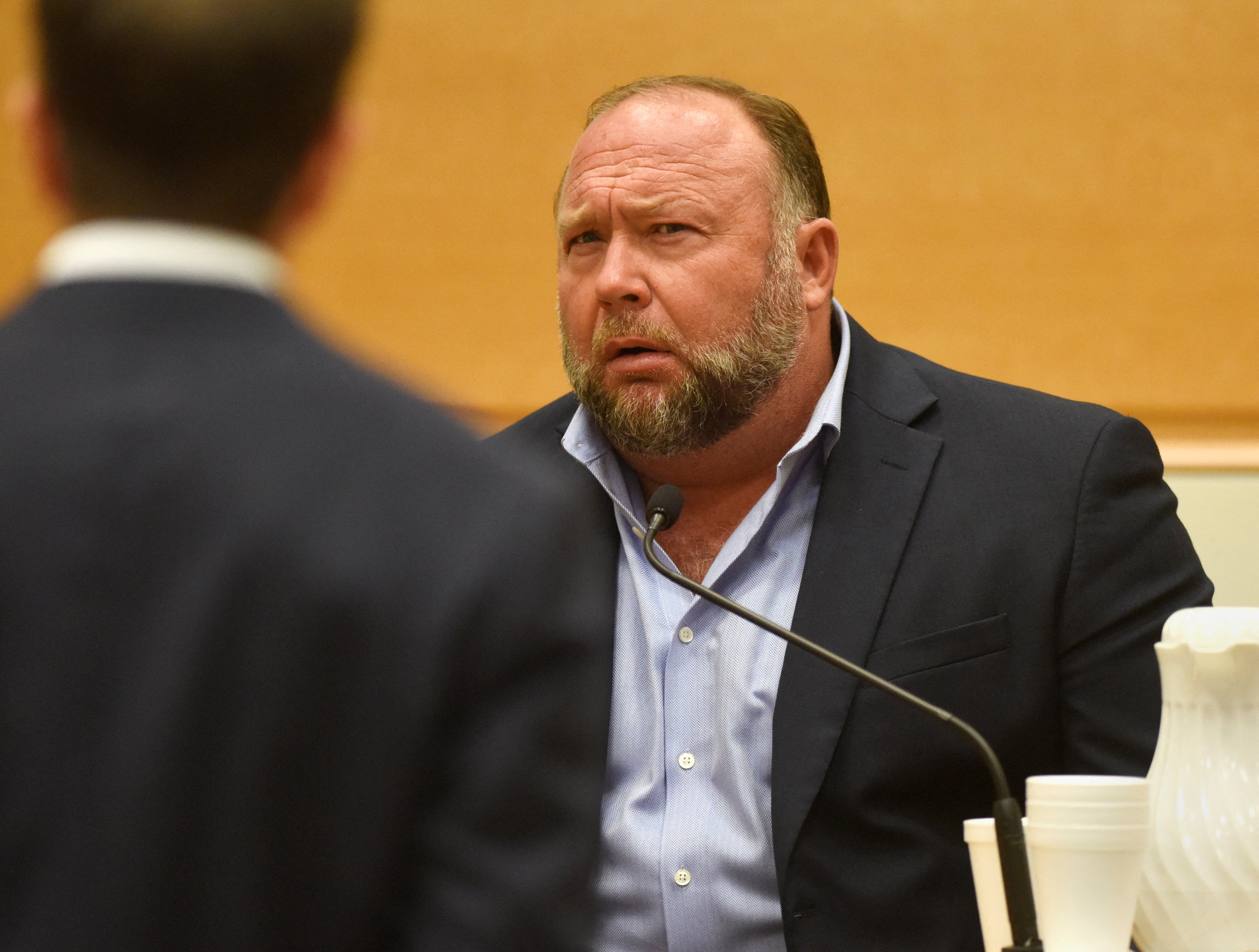 Infowars founder Alex Jones takes the witness stand to testify on 23 September