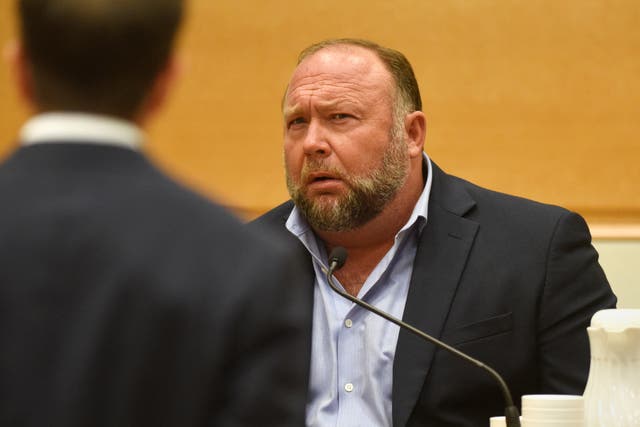 <p>Infowars founder Alex Jones takes the witness stand to testify on 23 September</p>