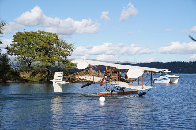 A replica of seaplane Waterbird on its first public flight on Lake Windermere in Cumbria (Owen Humphreys/PA)