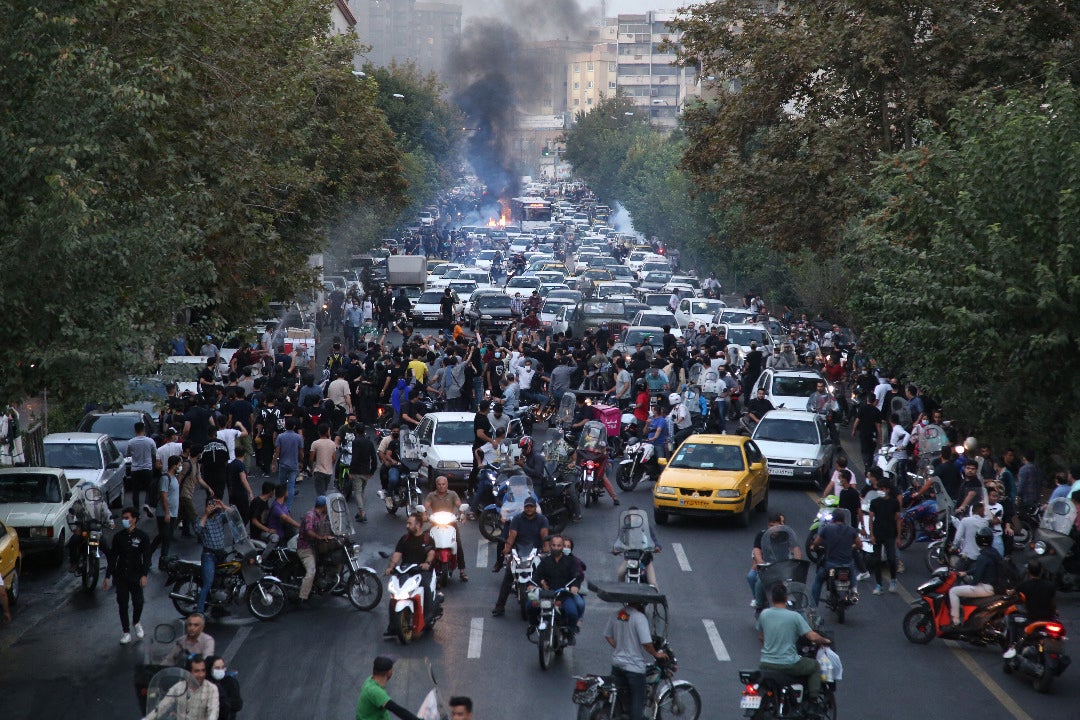 Iranian demonstrators taking to the streets of the capital Tehran during a protest for Mahsa Amini, days after she died in police custody