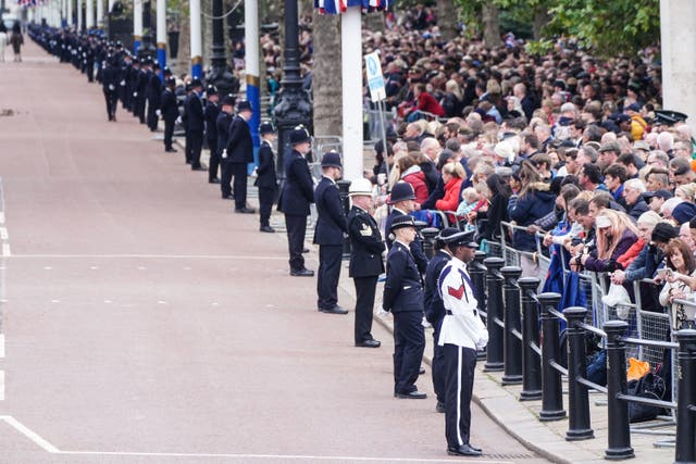 <p>Police officers line the Mall in central London on the day of the funeral of Queen Elizabeth II at Westminster Abbey (Ian West/PA)</p>