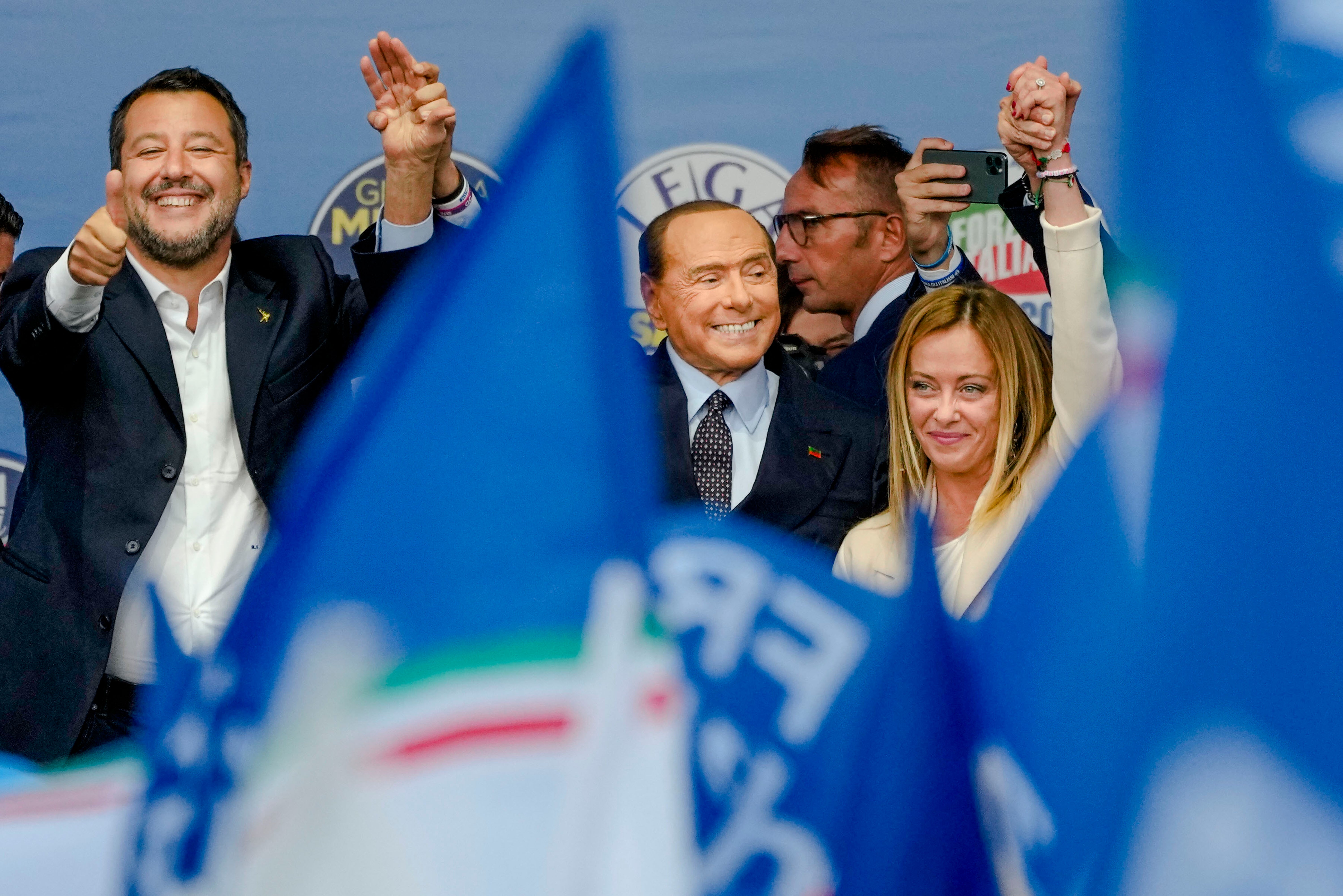 From left, Salvini, Berlusconi and Meloni attend the final rally of the centre-right coalition in Rome on Thursday