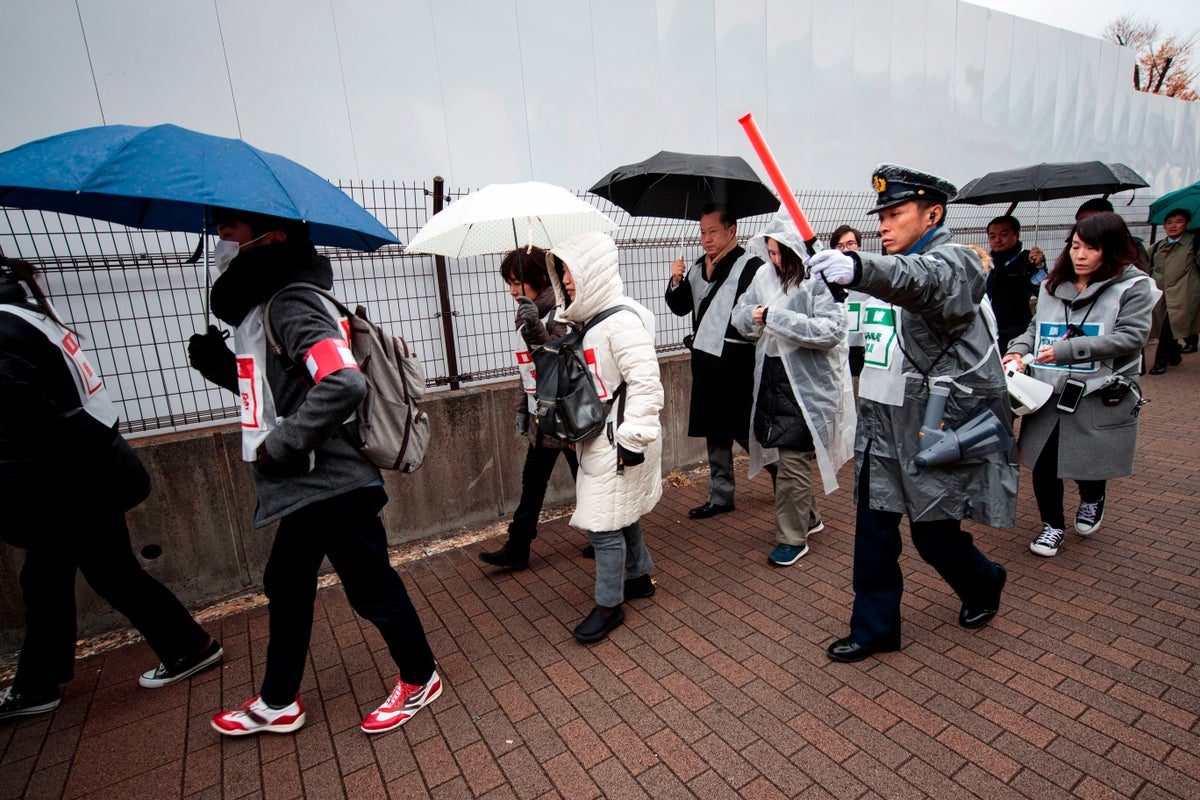 Typhoon lashes central Japan with torrential rain, fierce winds and landslides, killing two