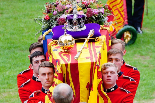 <p>Coffin bearers, including 19-year-old David Sanderson (front, right), carry the coffin of Queen Elizabeth II into St George’s Chapel on September 19, 202</p>