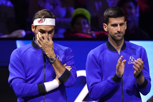 <p>Novak Djokovic, right, paid tribute to old rival Roger Federer after his retirement from competitive tennis on Friday (John Walton/PA)</p>