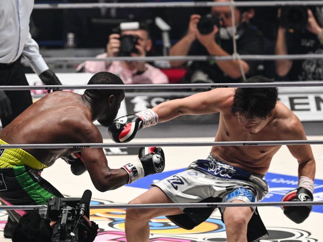 <p>Mayweather drops Asakura with the final punch of the second round </p>