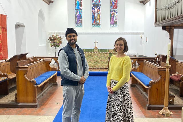 Sabah Ahmedi, who is one of Britain’s youngest Imams, with Charlotte Mathias, treasurer at All Saints Church in Tilford (MKA-UK/PA)