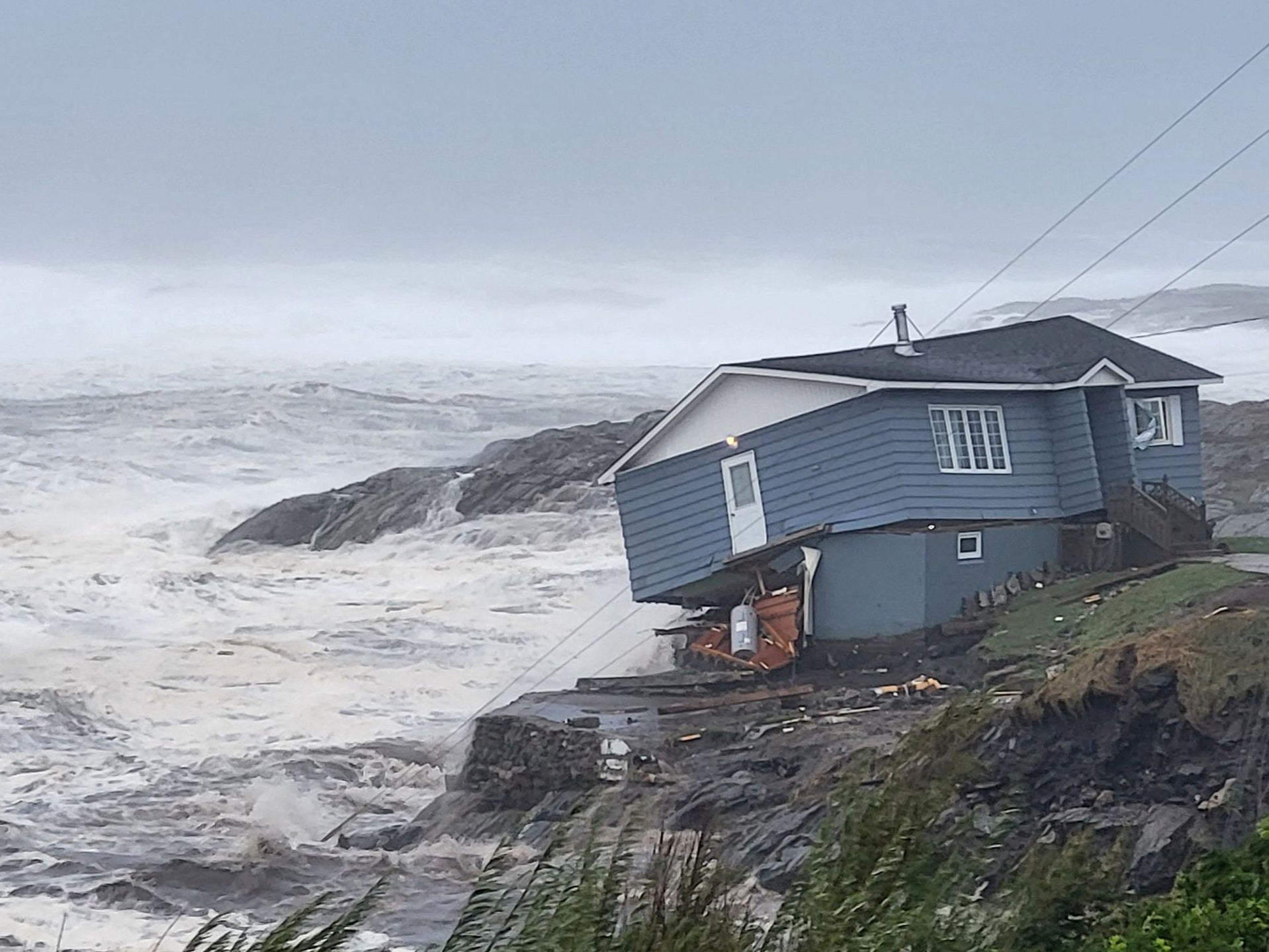 Homes have been destroyed near the sea during the tropical storm