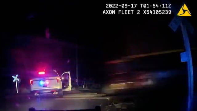 <p>Moment train hits a parked police car with suspect inside</p>