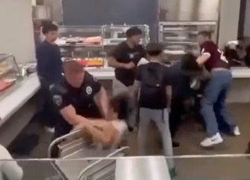 Footage captures officer hurling student onto lunch cart