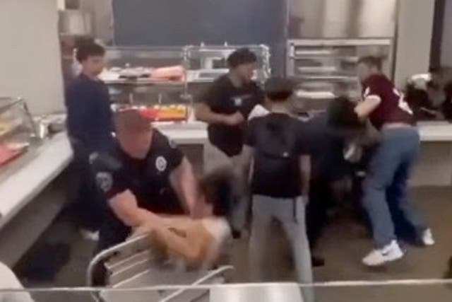<p>Footage captures officer hurling student onto lunch cart</p>