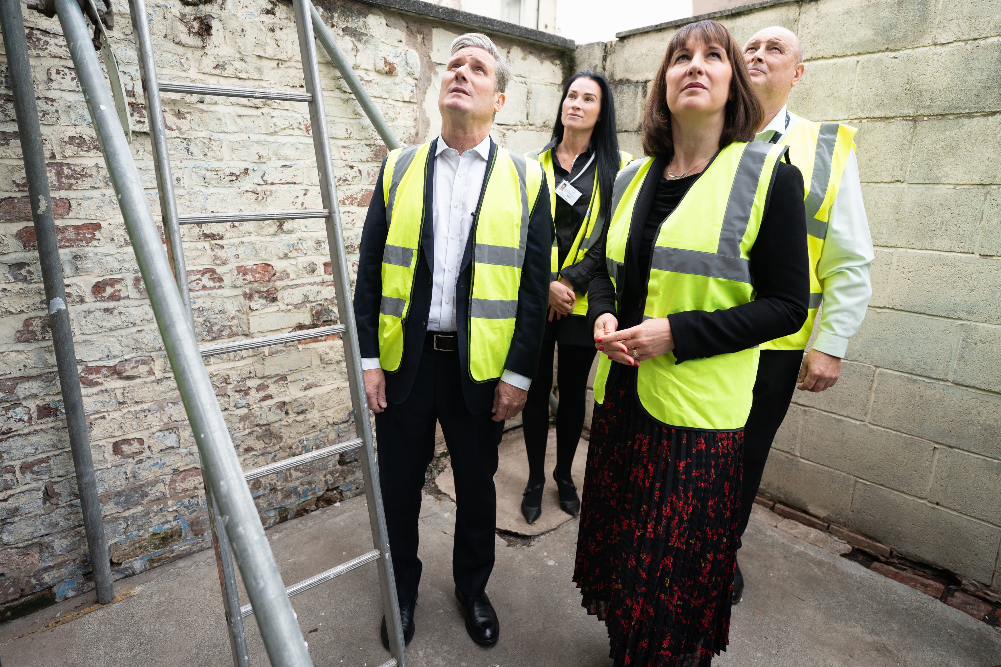 Labour leader Sir Keir Starmer and shadow chancellor Rachel Reeves visit an insulation project on a social housing site in Bootle (Stefan Rousseau/PA)