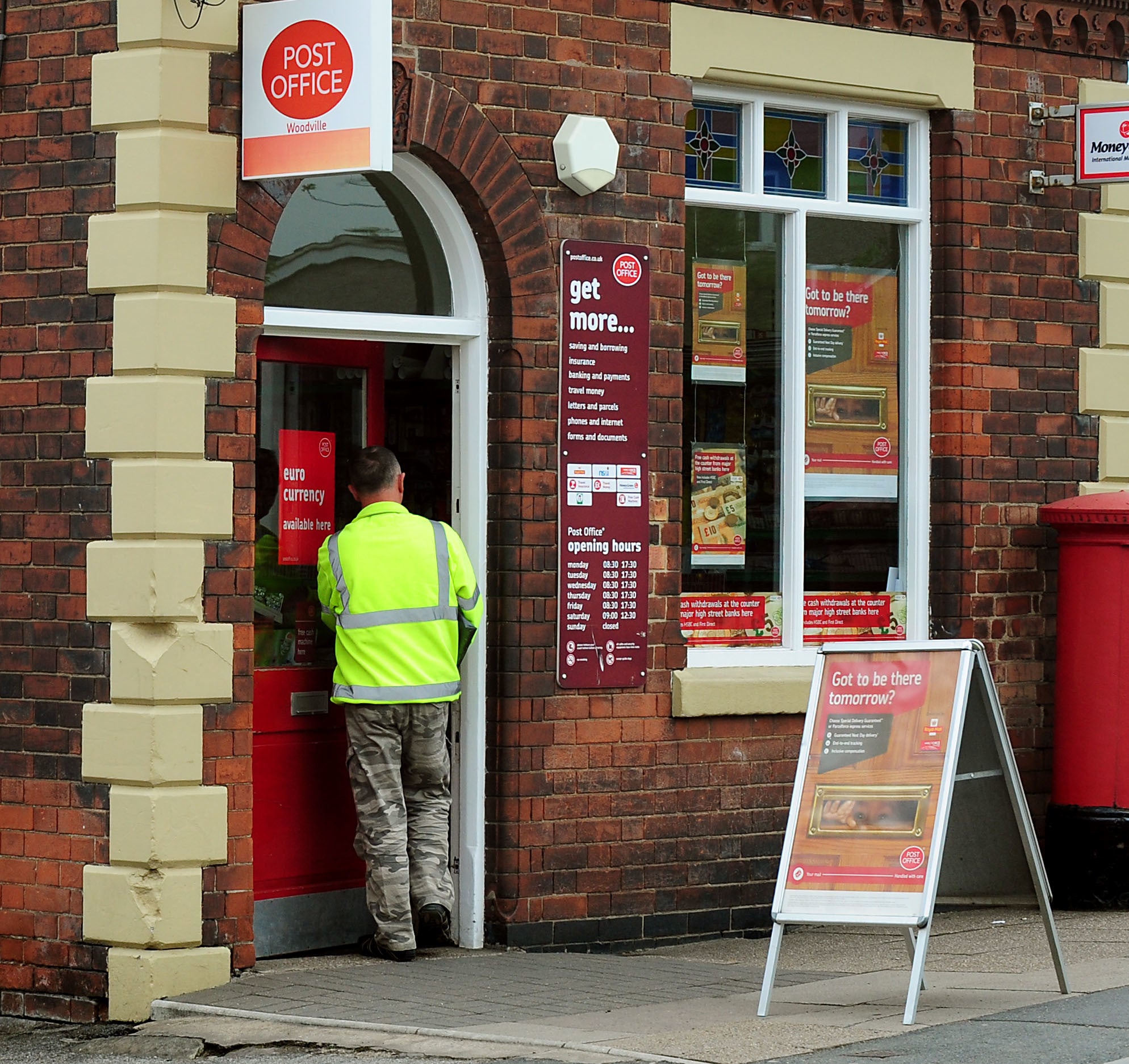 The Post Office says its branches are preparing for a spike in customers depositing paper £20 and £50 banknotes this week (Rui Vieira/PA)