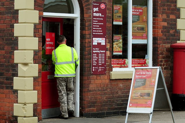 The Post Office says its branches are preparing for a spike in customers depositing paper £20 and £50 banknotes this week (Rui Vieira/PA)