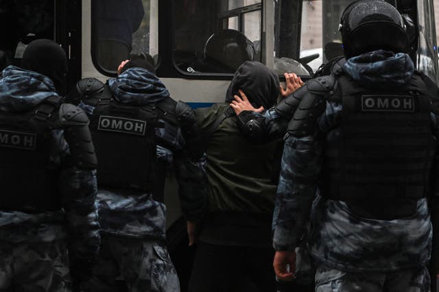 <p>File: Police officers detain a man in Moscow amid protest against the partial mobilisation announced by the Russian president Vladimir Putin </p>