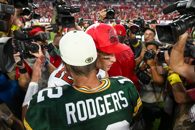 Green Bay Packers’ Aaron Rodgers hugs Tampa Bay Buccaneers’ Tom Brady (Jason Behnken/AP)