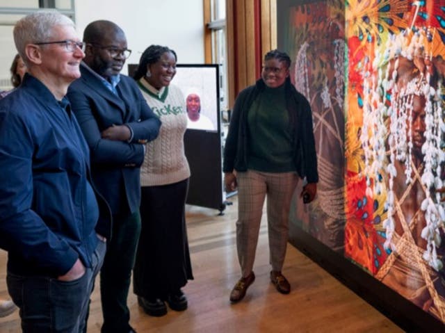 <p>Apple CEO Tim Cook, Soutbank Centre chair Misan Harriman, and Sofia Mpanda and Grace Olanma Etigwe-Uwa, who were both part of Photo-Fantastic</p>