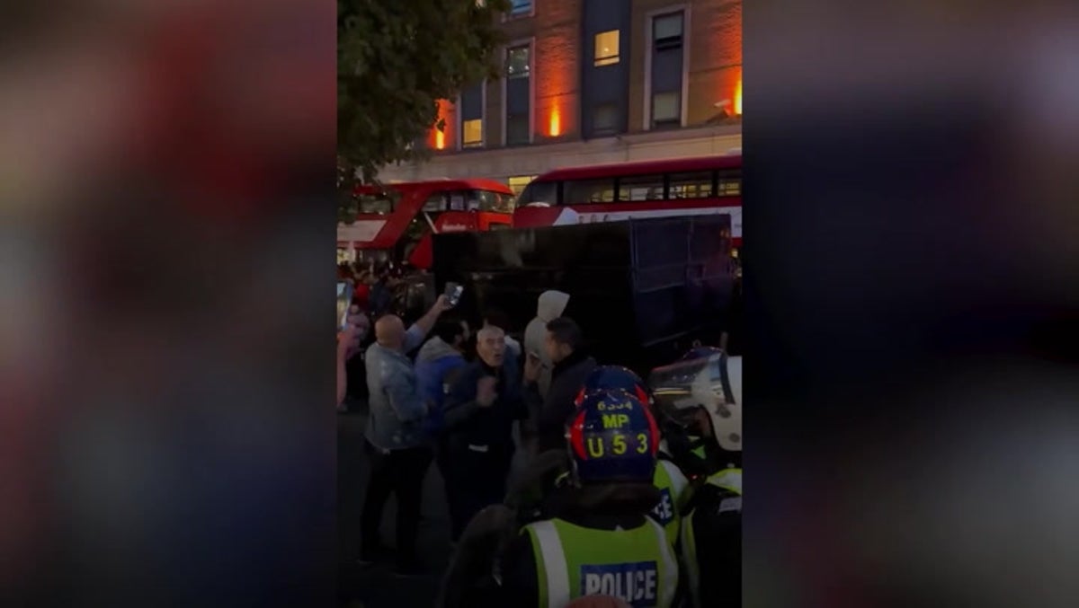 Clashes between protesters and police outside Iranian embassy in London