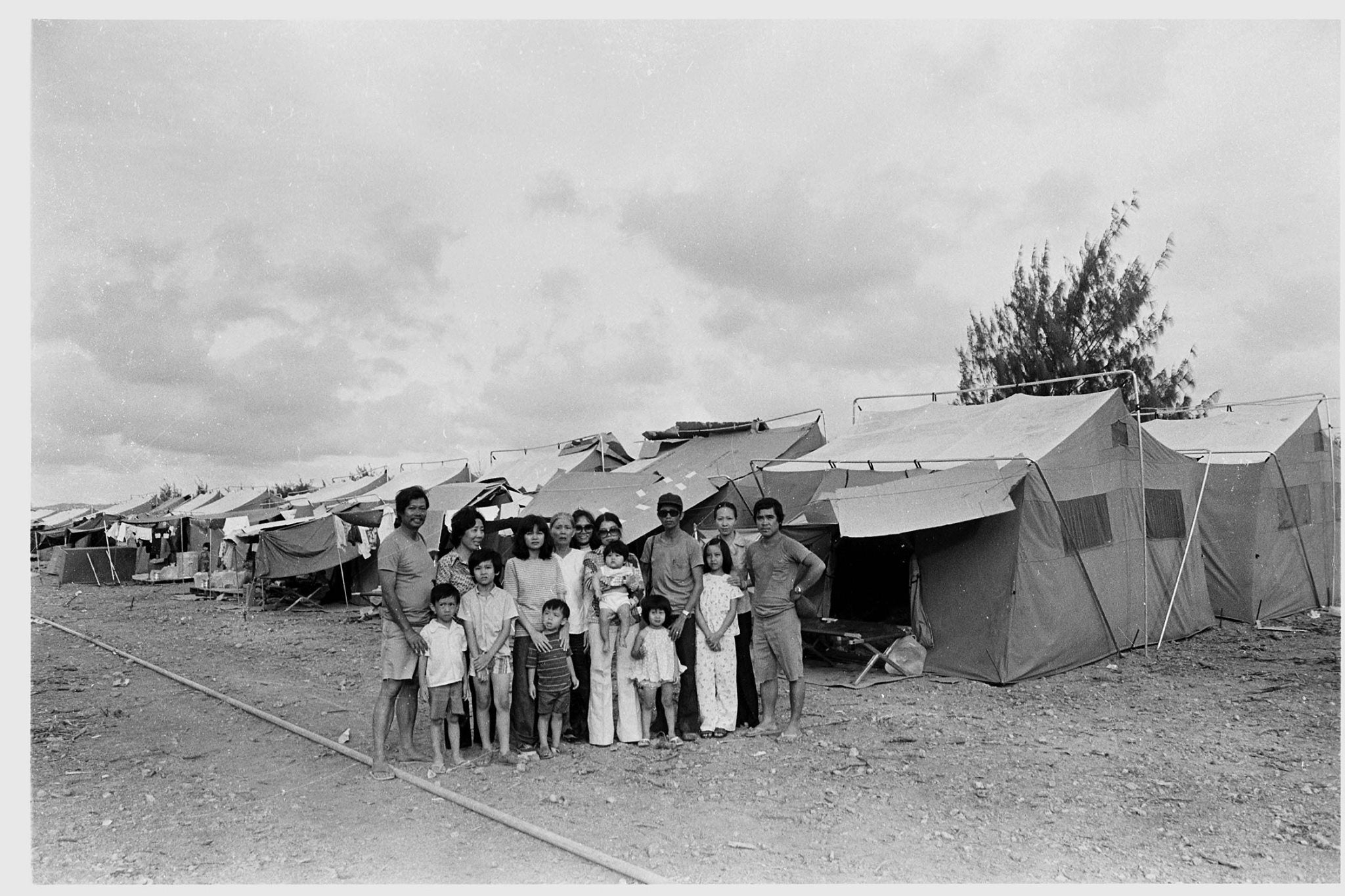 Ut joined AP at 16, determined to follow in his brother’s footsteps, here he is pictured with refugees