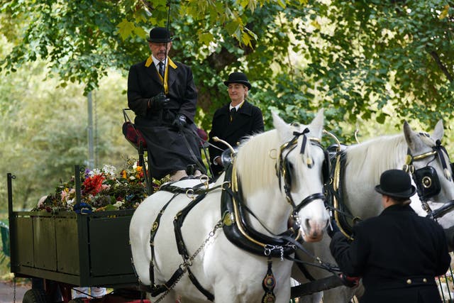 A number of horses were enlisted to help transport floral tributes left for the Queen from Green Park to Kensington Gardens (Yui Mok/PA)
