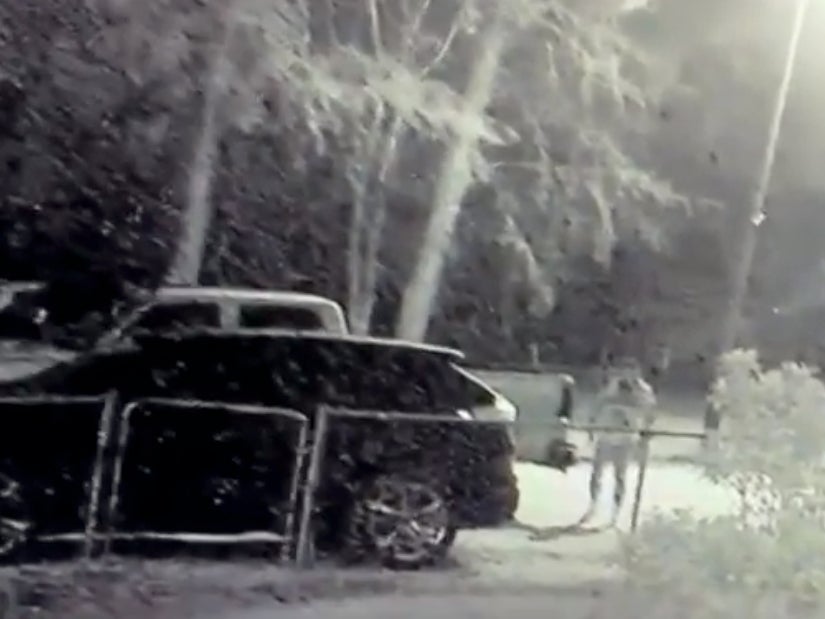 Surveillance footage shows a man identified as Clifford Jason Guynes inspecting vehicles in a Texas driveway