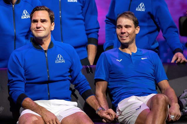 <p>Roger Federer and Rafael Nadal hold hands during the Laver Cup last week</p>