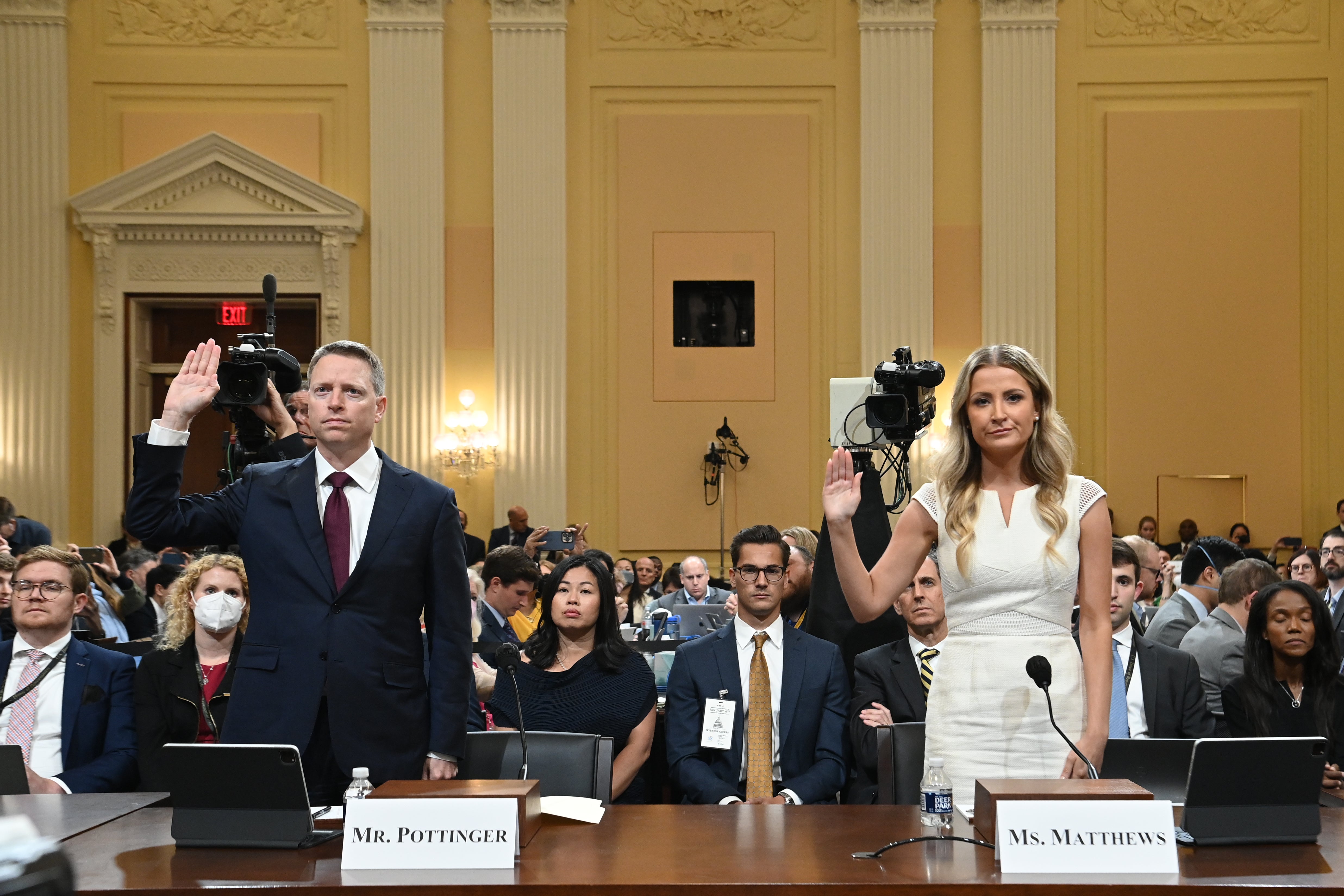 Former National Security Council member Matthew Pottinger and former Deputy White House Press Secretary Sarah Matthews are sworn in during a hearing