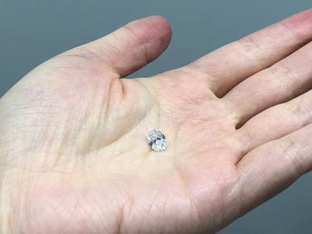 <p>The 1.5 ct diamond studied here sitting on the hand of Dr Tingting Gu</p>