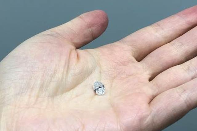 <p>The 1.5 ct diamond studied here sitting on the hand of Dr Tingting Gu</p>