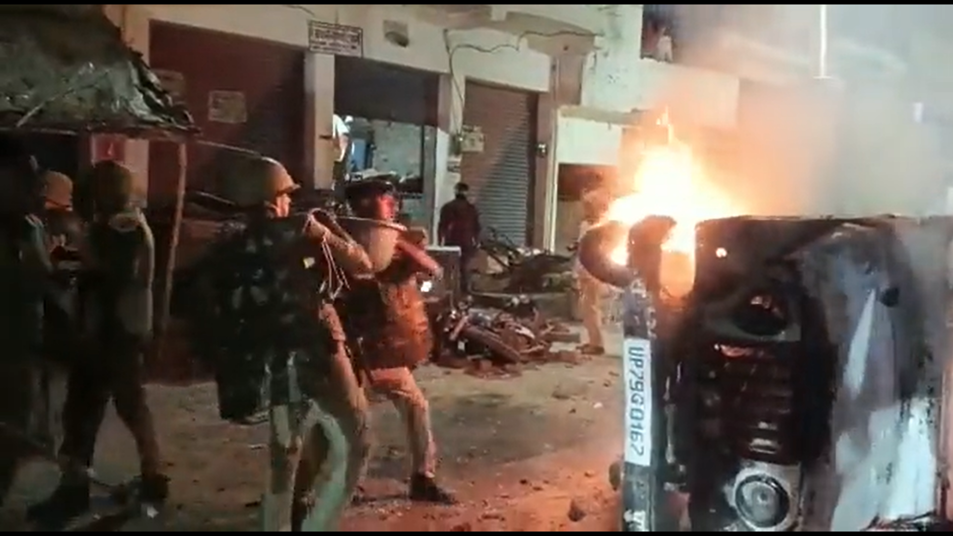 <p>Protesters set fire to police vehicles after a Dalit boy was allegedly beaten to death by his teacher in Auraiya, Uttar Preadesh </p>