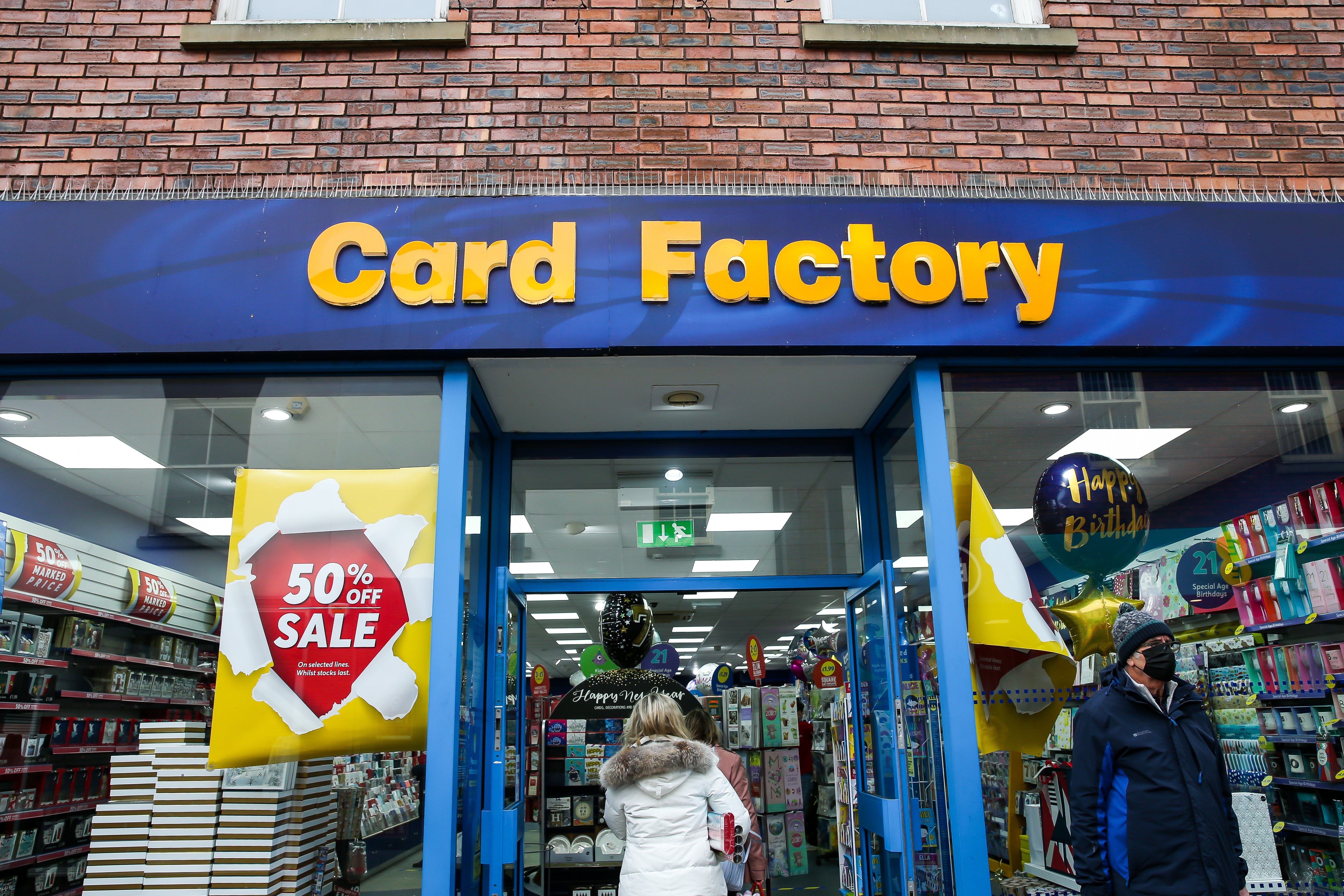 Shoppers entering the Card Factory in Newcastle-under-Lyme (Barrington Commbs/PA)
