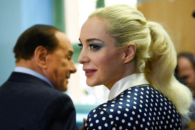 <p>Forza Italia party leader Silvio Berlusconi and Marta Fascina visit a polling station during the election</p>