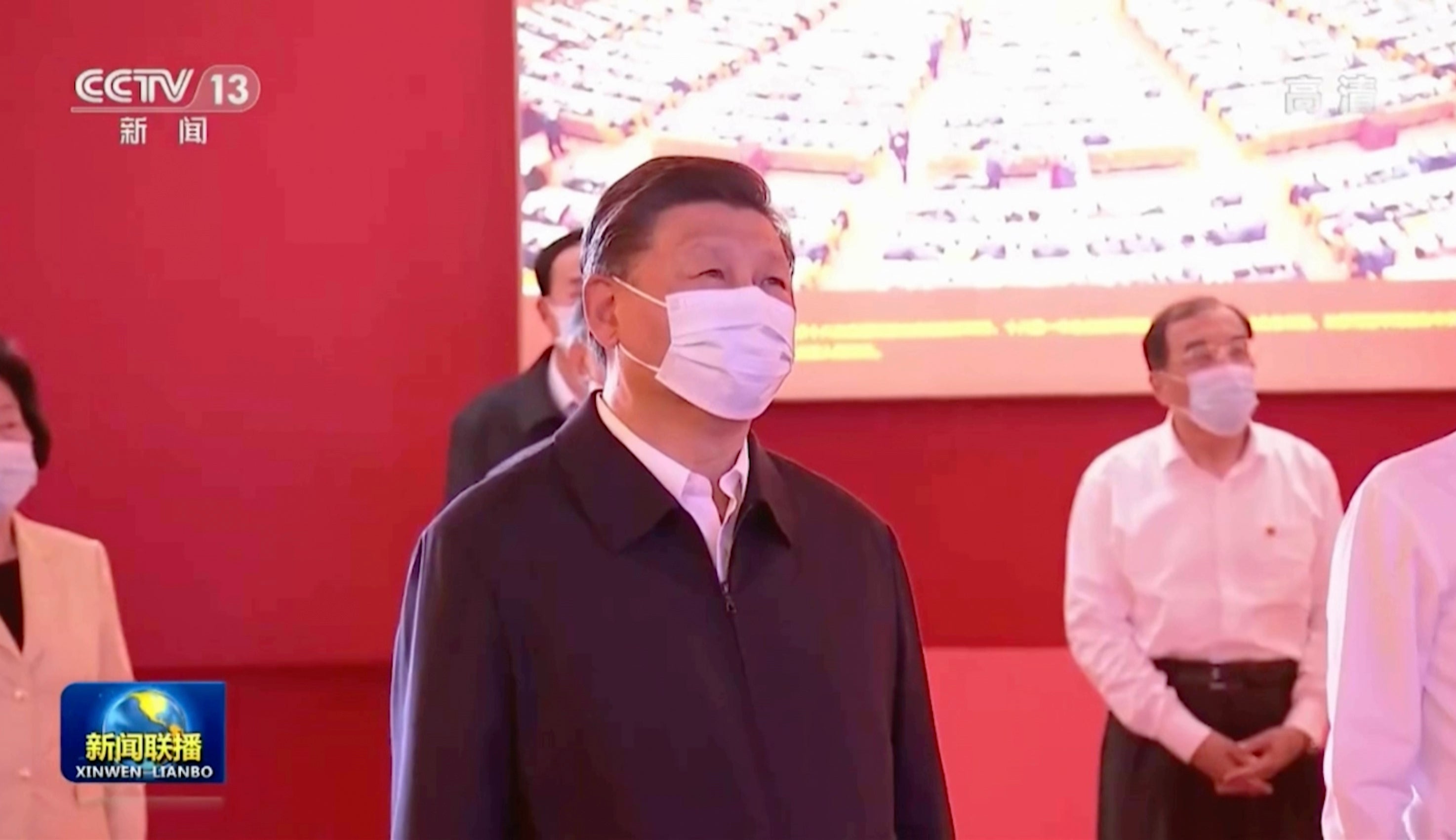In this image taken from video footage run by China's CCTV, Chinese President Xi Jinping and other Chinese leaders visit an exhibit with the theme of "Forging Ahead into the New Era" at the Beijing Exhibition Hall on Tuesday, 27 September 2022