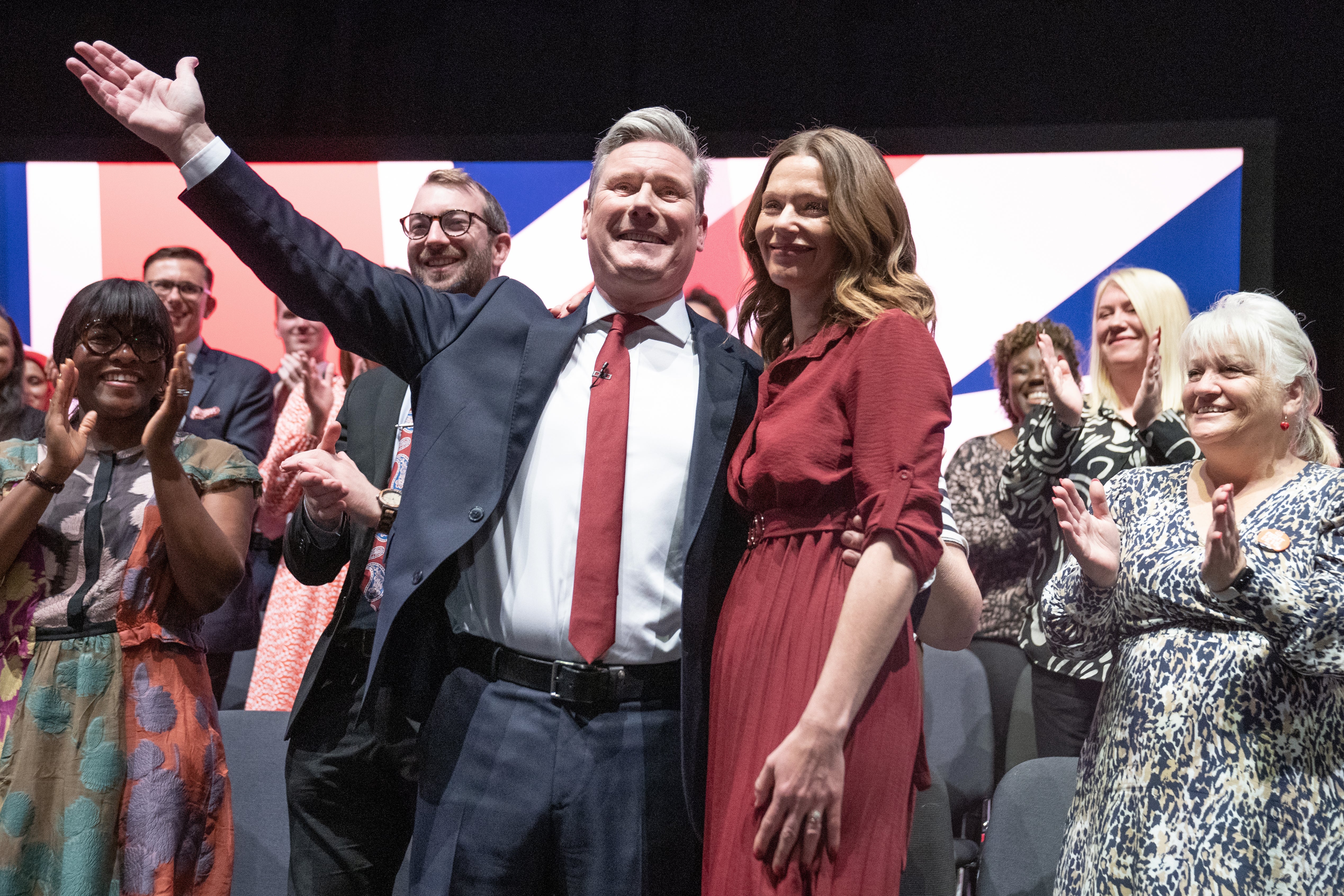 Labour leader Sir Keir Starmer is joined on stage by his wife Victoria (PA)