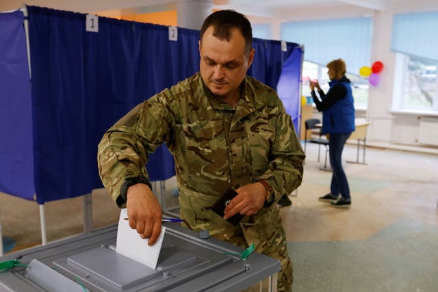 <p>A man votes at a polling station during a “sham” referendum in Donetsk province, Ukraine. </p>