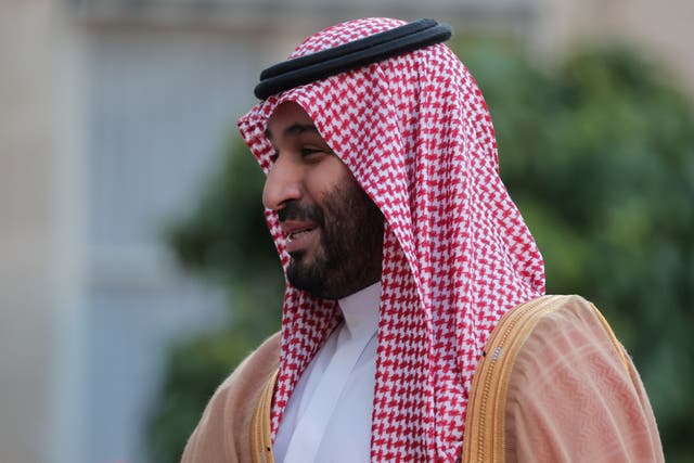 <p>File: Saudi crown prince Mohammed bin Salman reaches out to shake hands with French President Emmanuel Macron as he arrives for a dinner at the Elysee Palace in July</p>