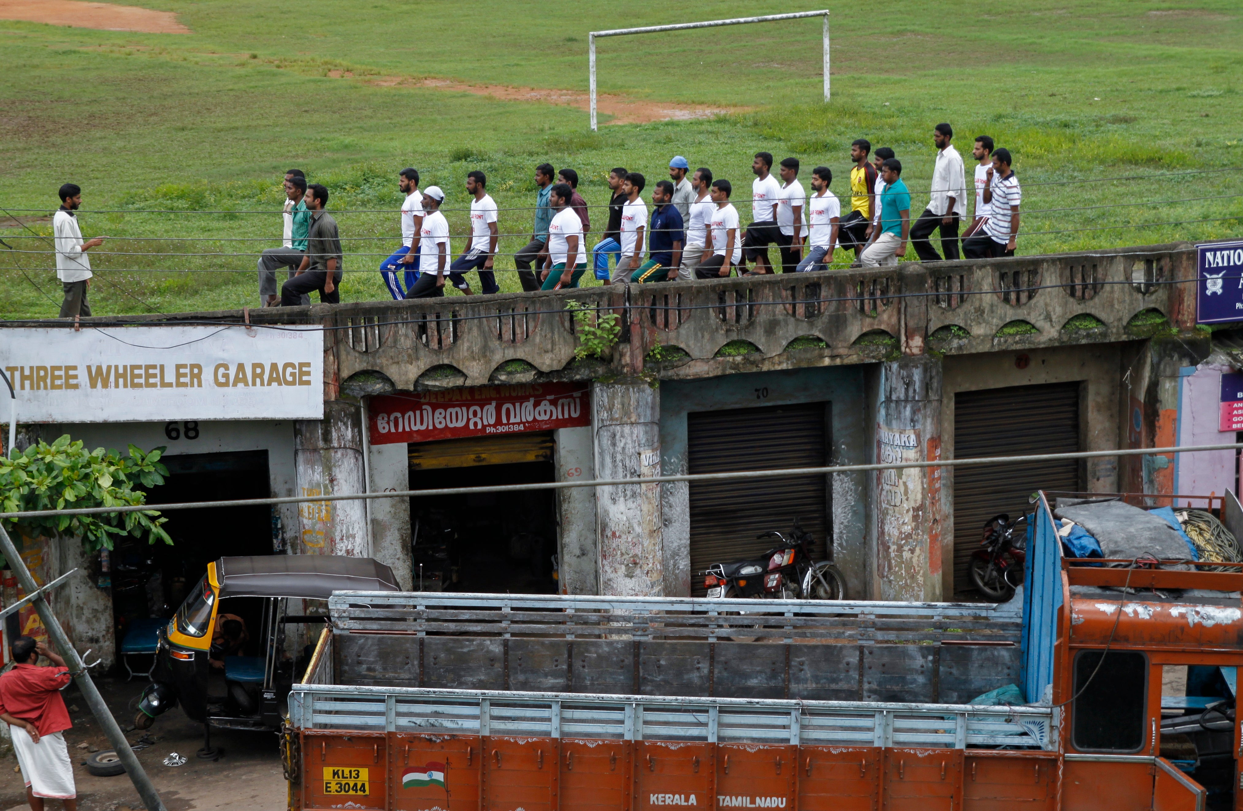 Members of the Muslim organization Popular Front of India (PFI) undergo parade training at a football ground in Kottayam, southern Kerala state, India, 27 June 2010