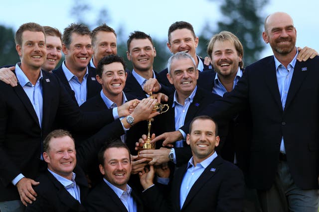 Team Europe pose with the Ryder Cup after their victory over the United States at Gleneagles in 2014 (Lynne Cameron/PA)