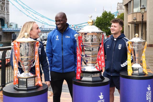 Martin Offiah, centre, with England Women’s player Jodie Cunningham, left, and England Wheelchair player Tom Halliwell (Kieran Cleeves/PA)