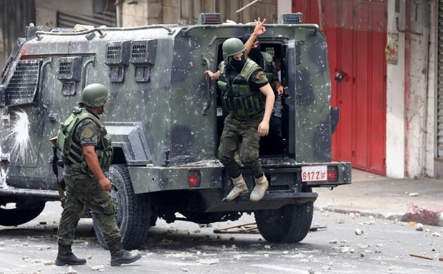 <p>Palestinian Authority security forces during clashes with Palestinain protesters in the West Bank city of Nablus in September </p>