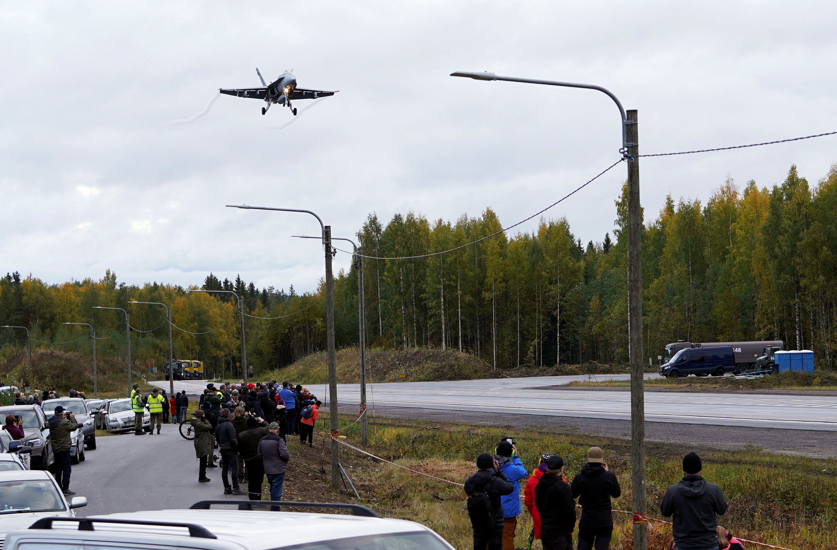 A F/A-18 Hornet fighter jet lands on a motorway in Joutsa, Finland