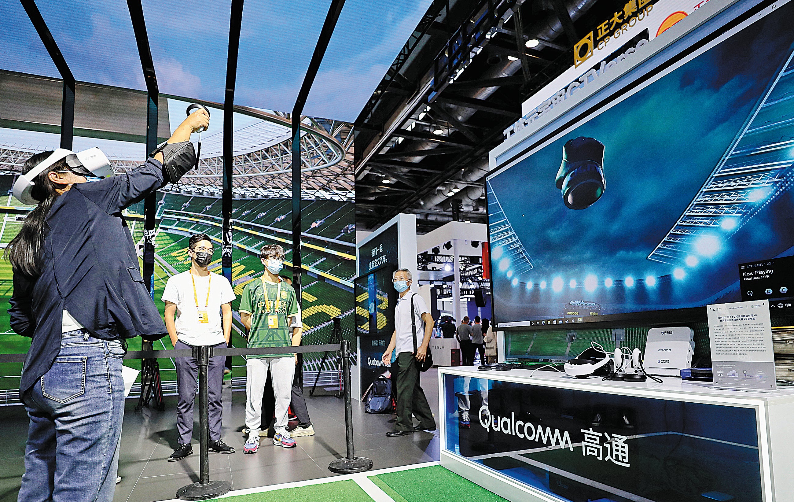 A visitor (left) tries out GTVerse, a business-to-consumer mixed reality social network platform, at the China International Fair for Trade in Services in Beijing on 1 September 2022