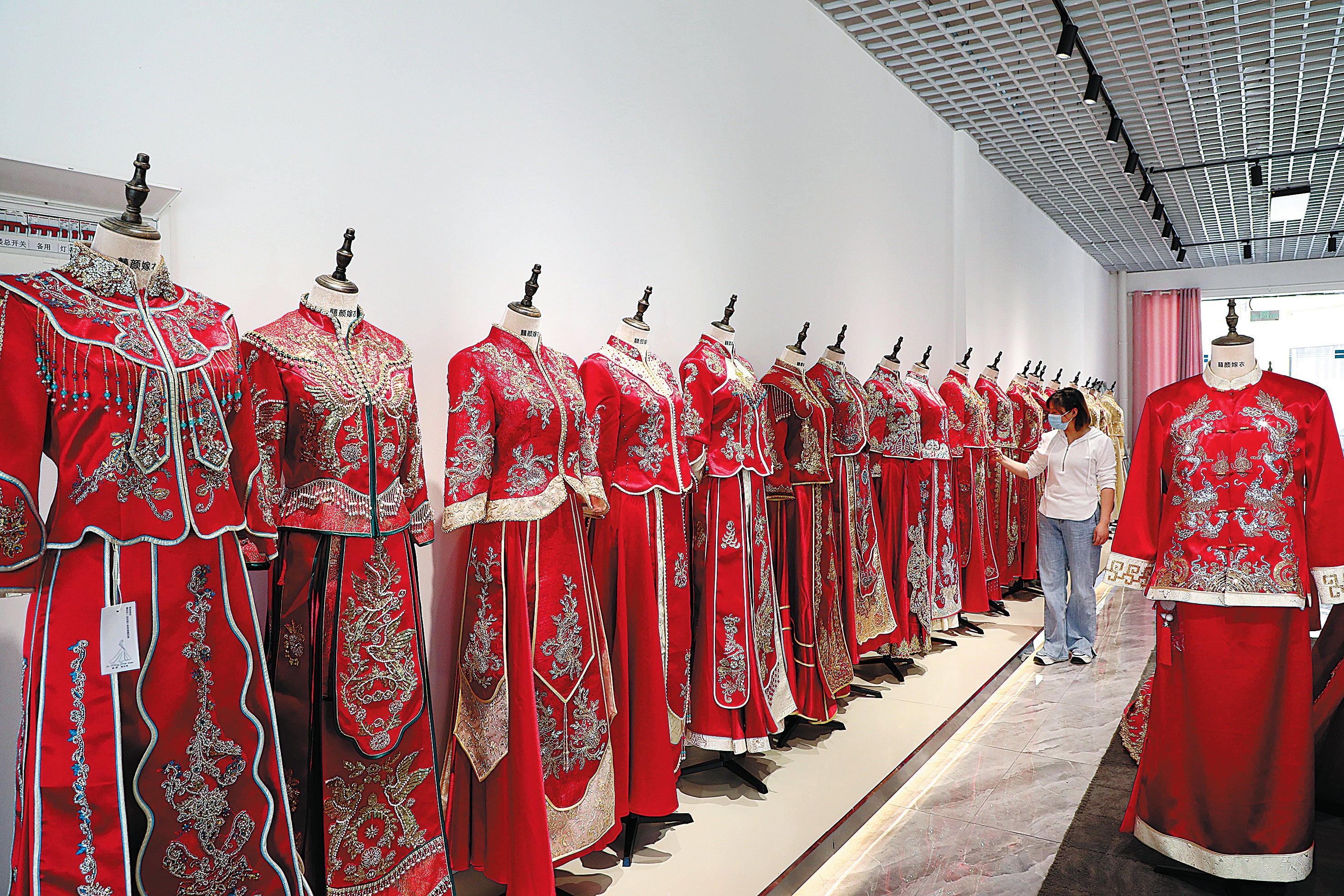 Handmade Chinese wedding gowns on display in a factory in Lu’an, Anhui province, in May.