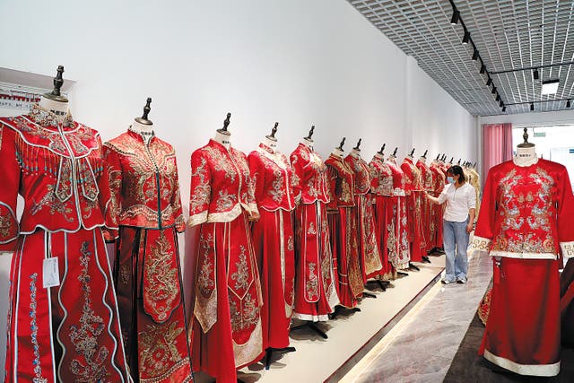 <p>Handmade Chinese wedding gowns on display in a factory in Lu’an, Anhui province, in May.  </p>