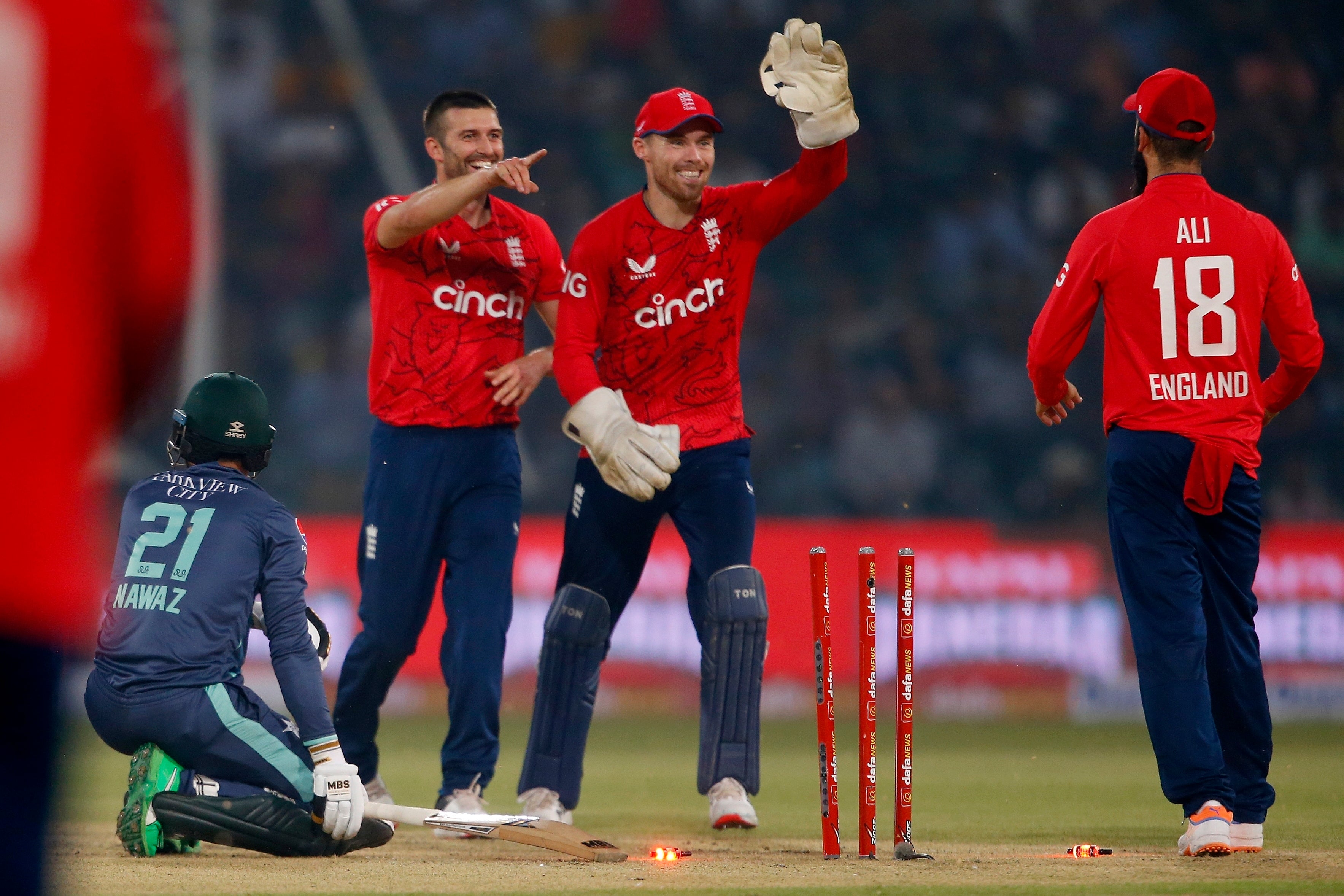 Mark Wood, left, took three wickets for England (K.M. Chaudary/AP)