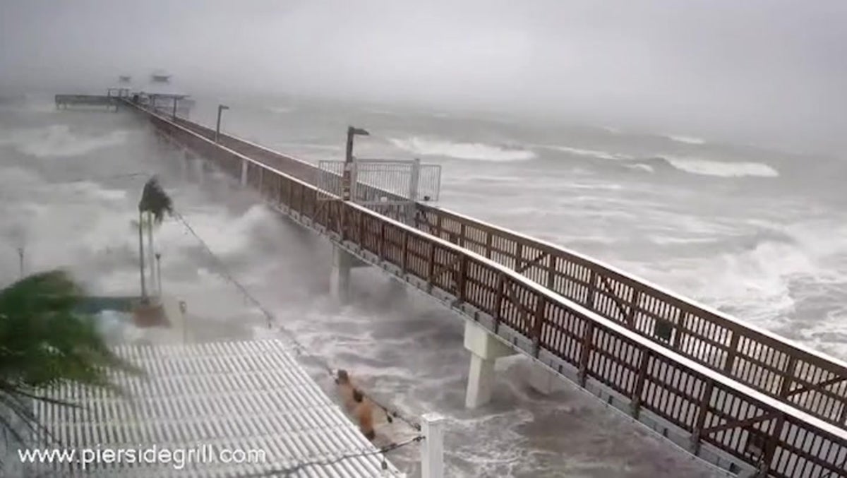 Florida men play in waves as Hurricane Ian makes landfall