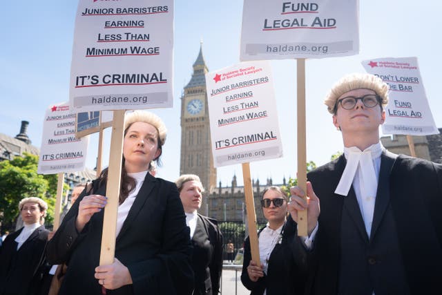<p>Criminal defence barristers outside the Houses of Parliament </p>