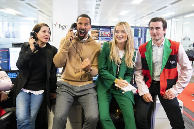 (left to right) Sadie Frost, Rio Ferdinand and Laura Whitmore during the BGC annual charity day at Canary Wharf in London ((Kirsty O’Connor/PA)
