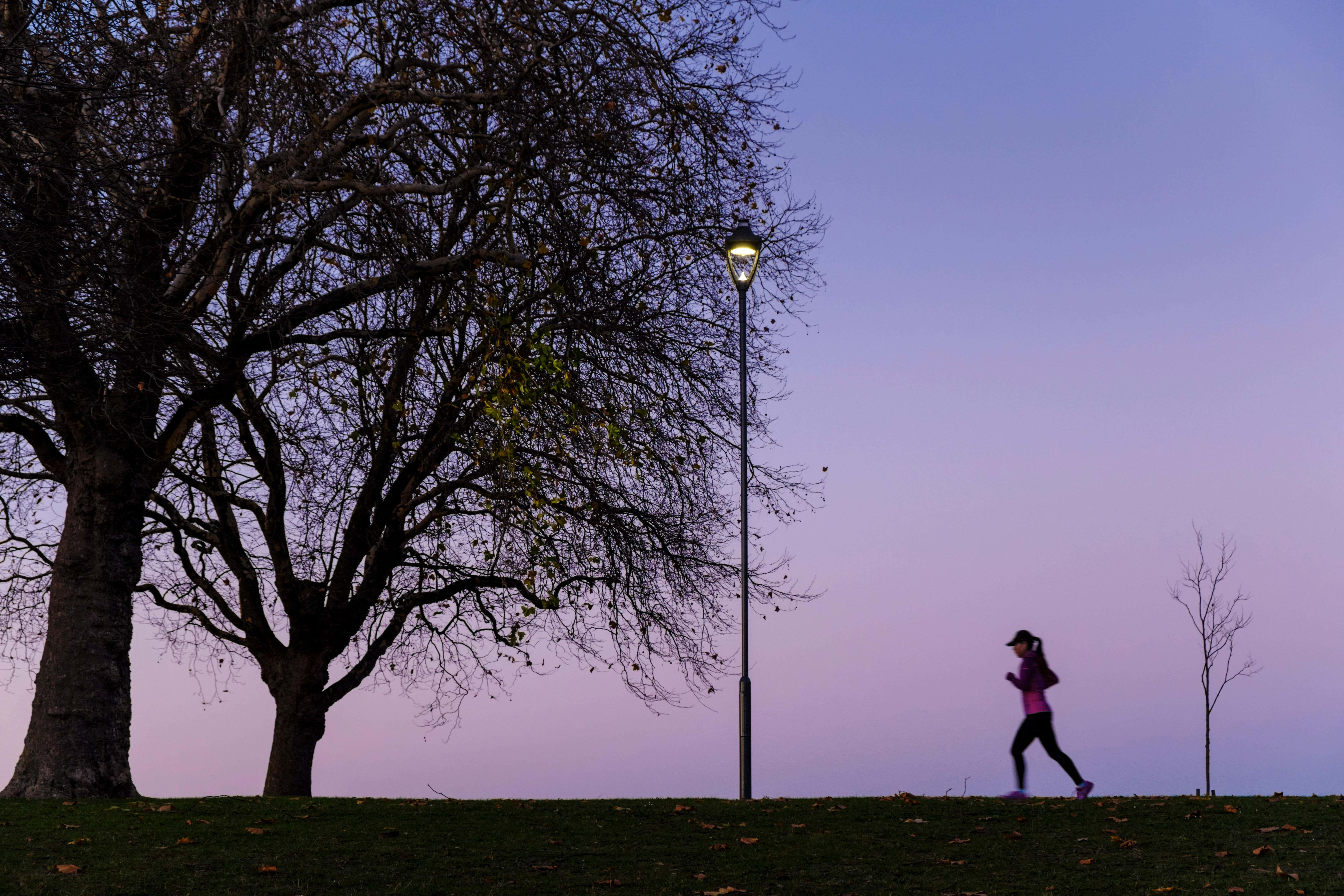 A woman running at dusk